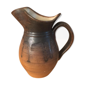Antique ceramic pitcher with drips and striated patterns gradients of chestnuts