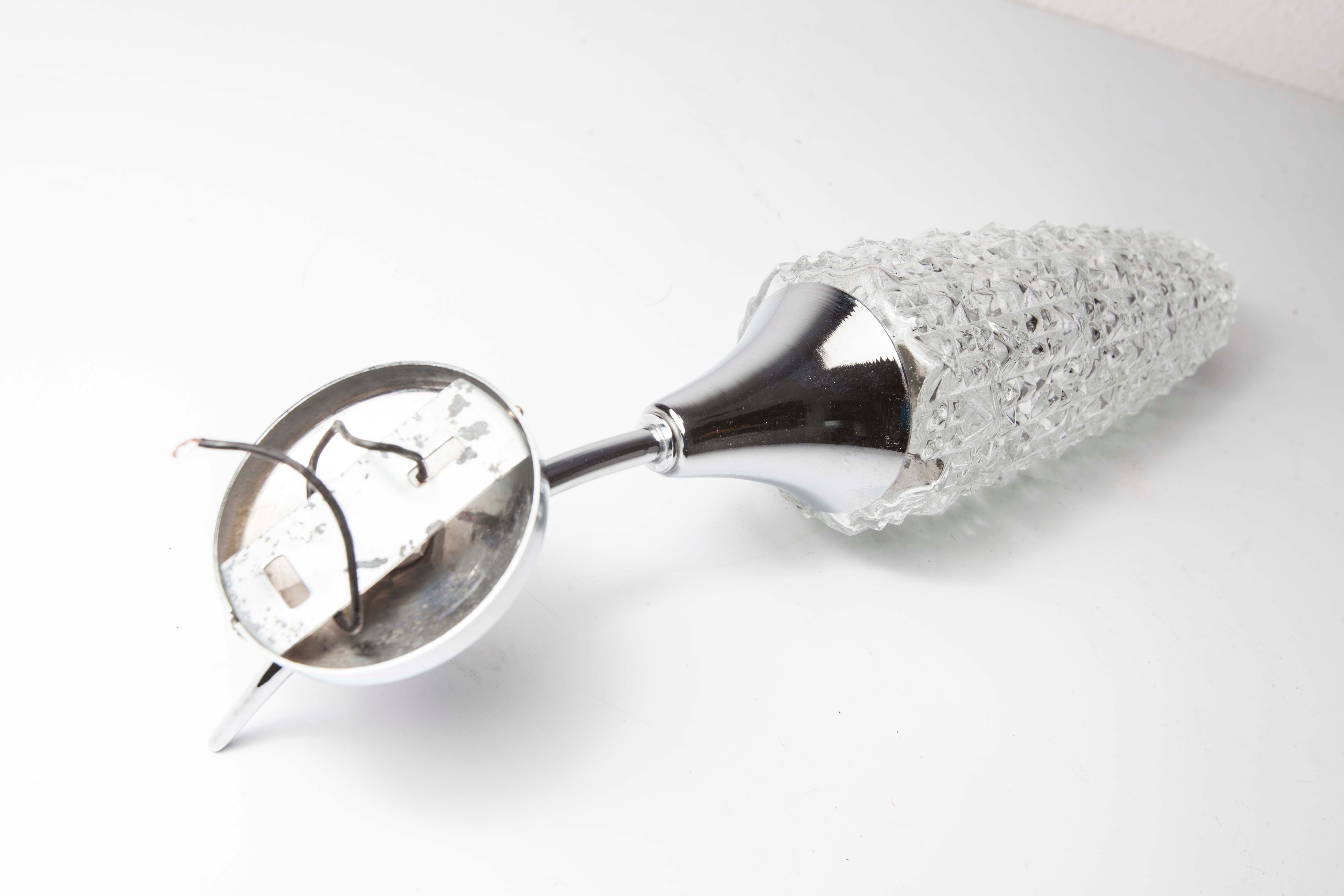 Torch wall lampof the 60s in silver and glass