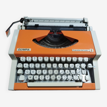 Machine à écrire Olympia traveller de luxe orange révisé et ruban neuf