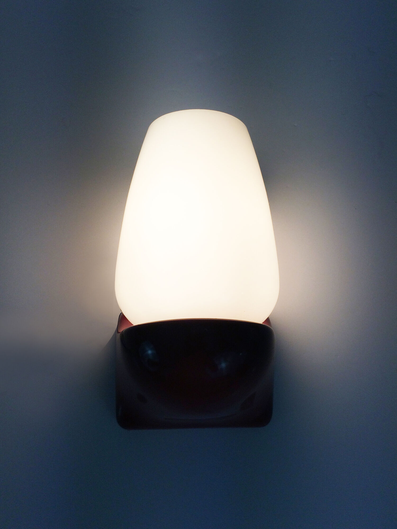 Vintage wall lamp in burgundy pvc and globe in white opaline. Year 70