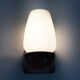 Vintage wall lamp in burgundy pvc and globe in white opaline. Year 70