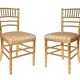 Pair of golden wood chairs in a bamboo style.