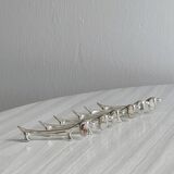 6 dog-shaped knife rests, in silver-plated metal.