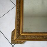 Mirror with gilded wood and stucco frame, early 20th century, 59x83cm