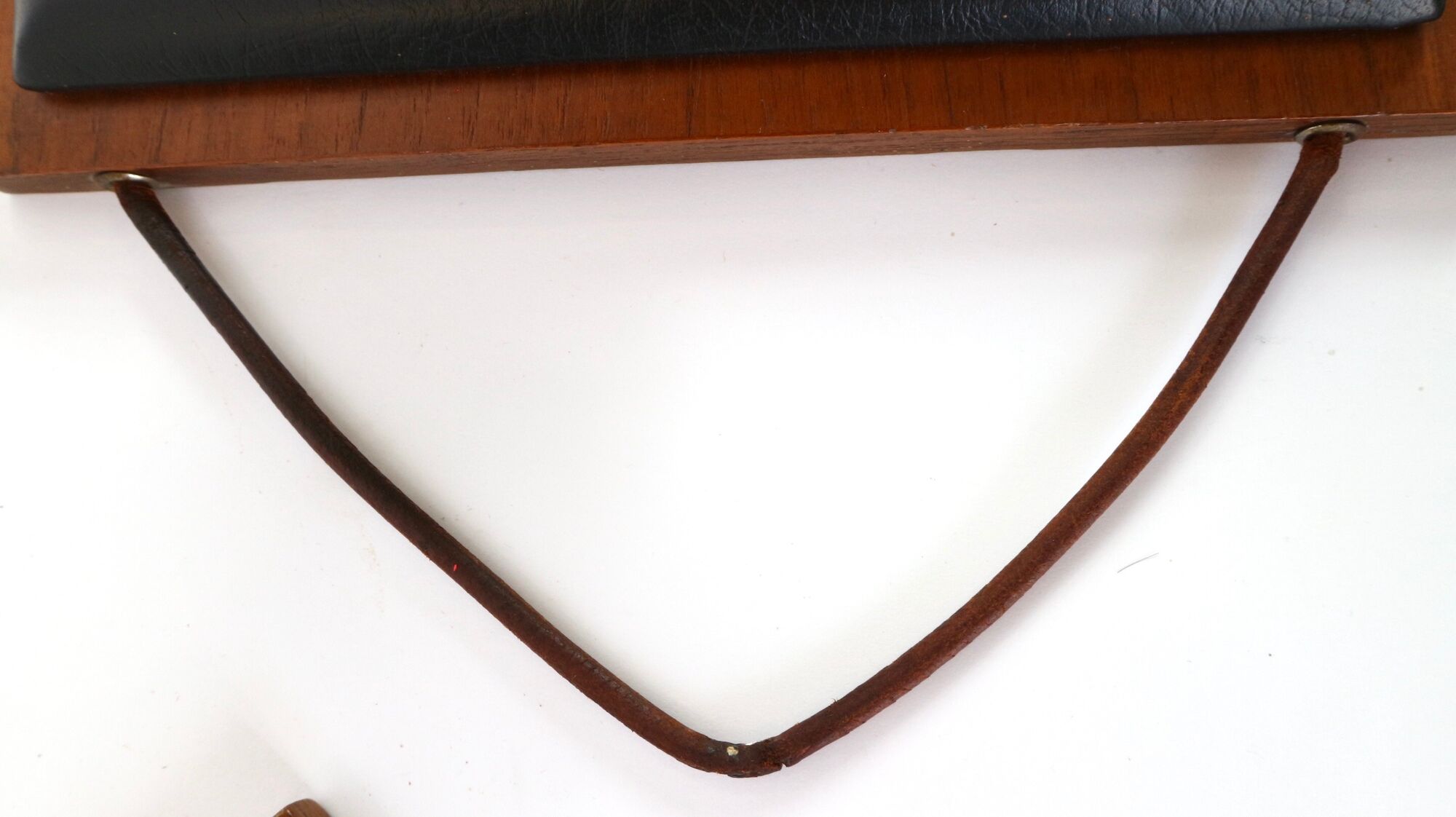 Two coat hangers, wood, leather and black leather, 70s