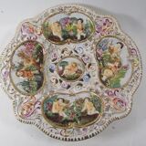Capedimonté openwork plate, 4 seasons putto