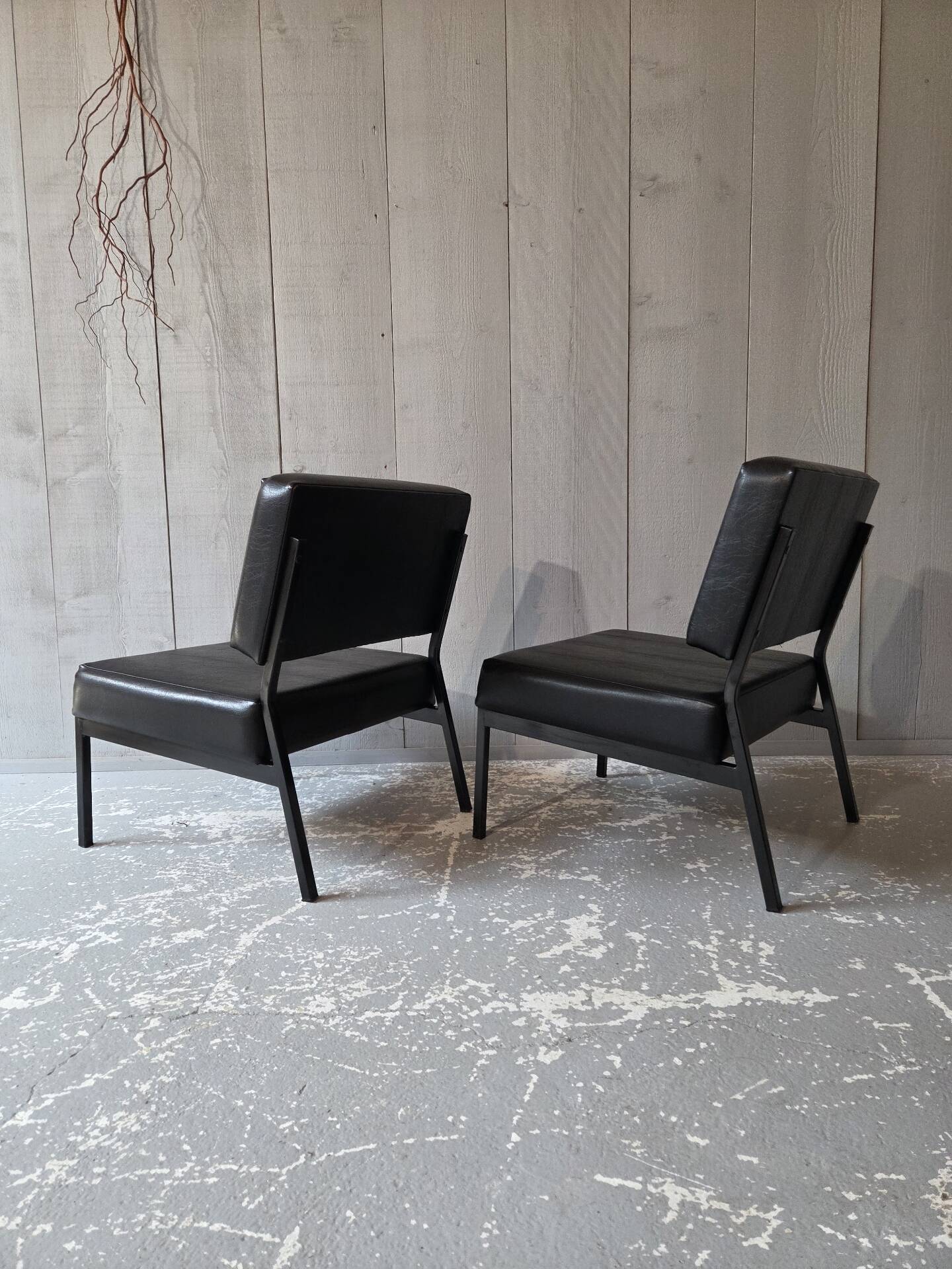 2 faux leather armchairs