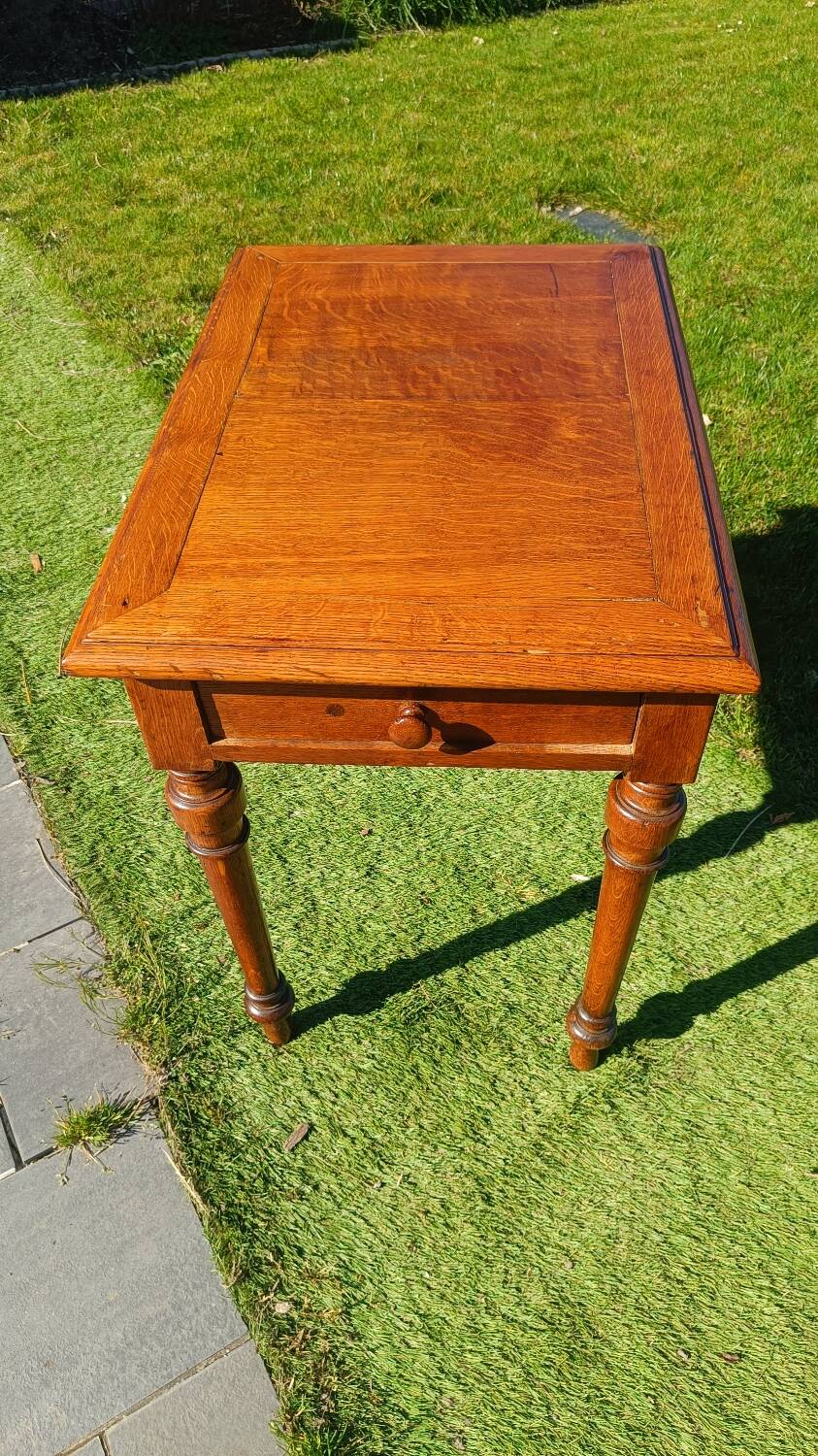 Antique solid wood table with a through drawer.