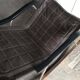 Mid-Century Japanese rocking chair in black leather, metal, and wood by Takeshi Nii (1950s)