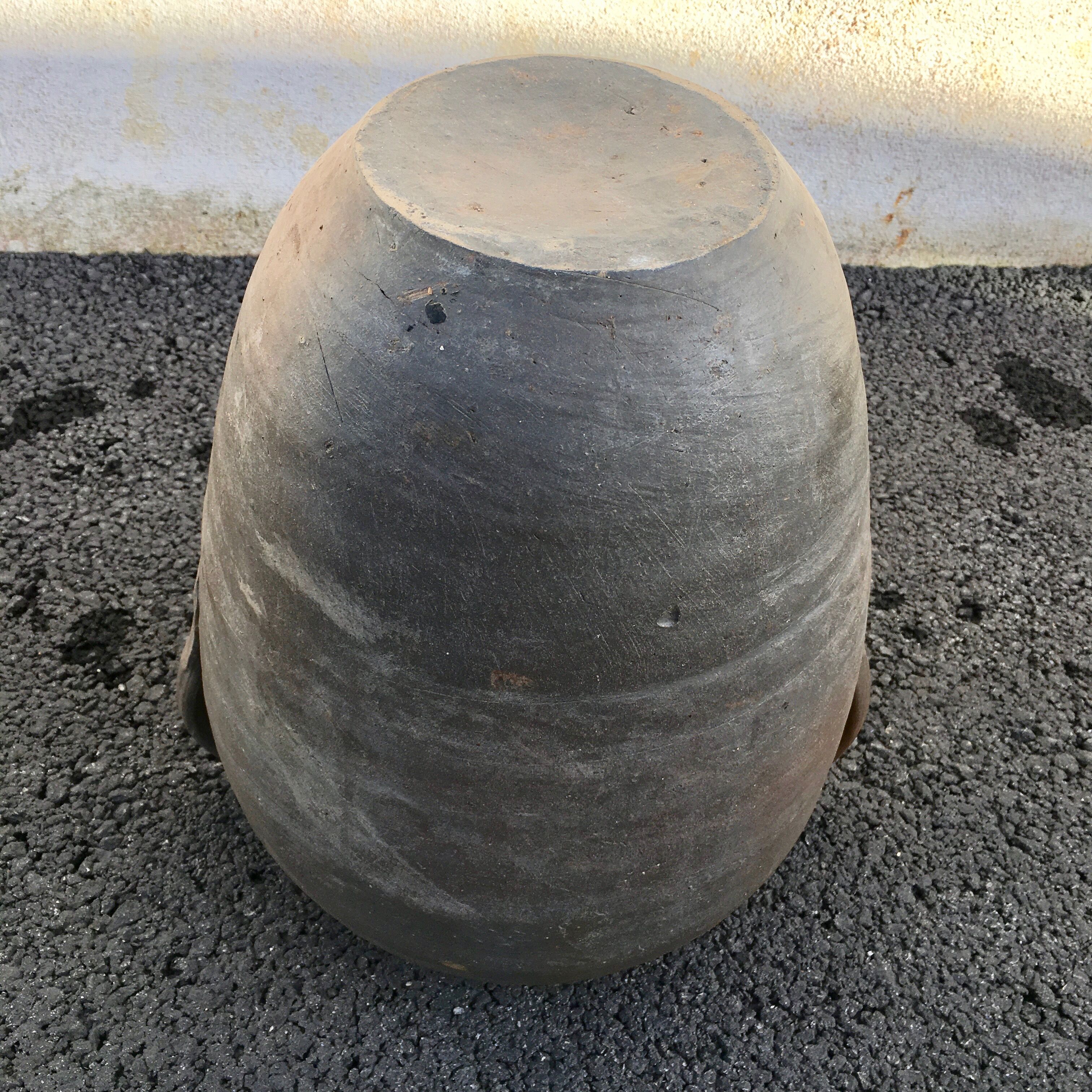Old jug with two sandstone handles