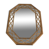 Octagonal mirror in gilded wood with closed guards