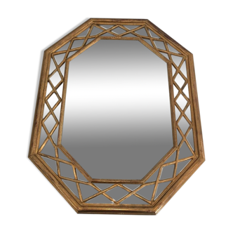 Octagonal mirror in gilded wood with closed guards