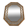 Octagonal mirror in gilded wood with closed guards