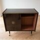 Vintage 1950s TV cabinet in wood with gold details.