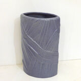 Purple vase, draped ribbons in relief