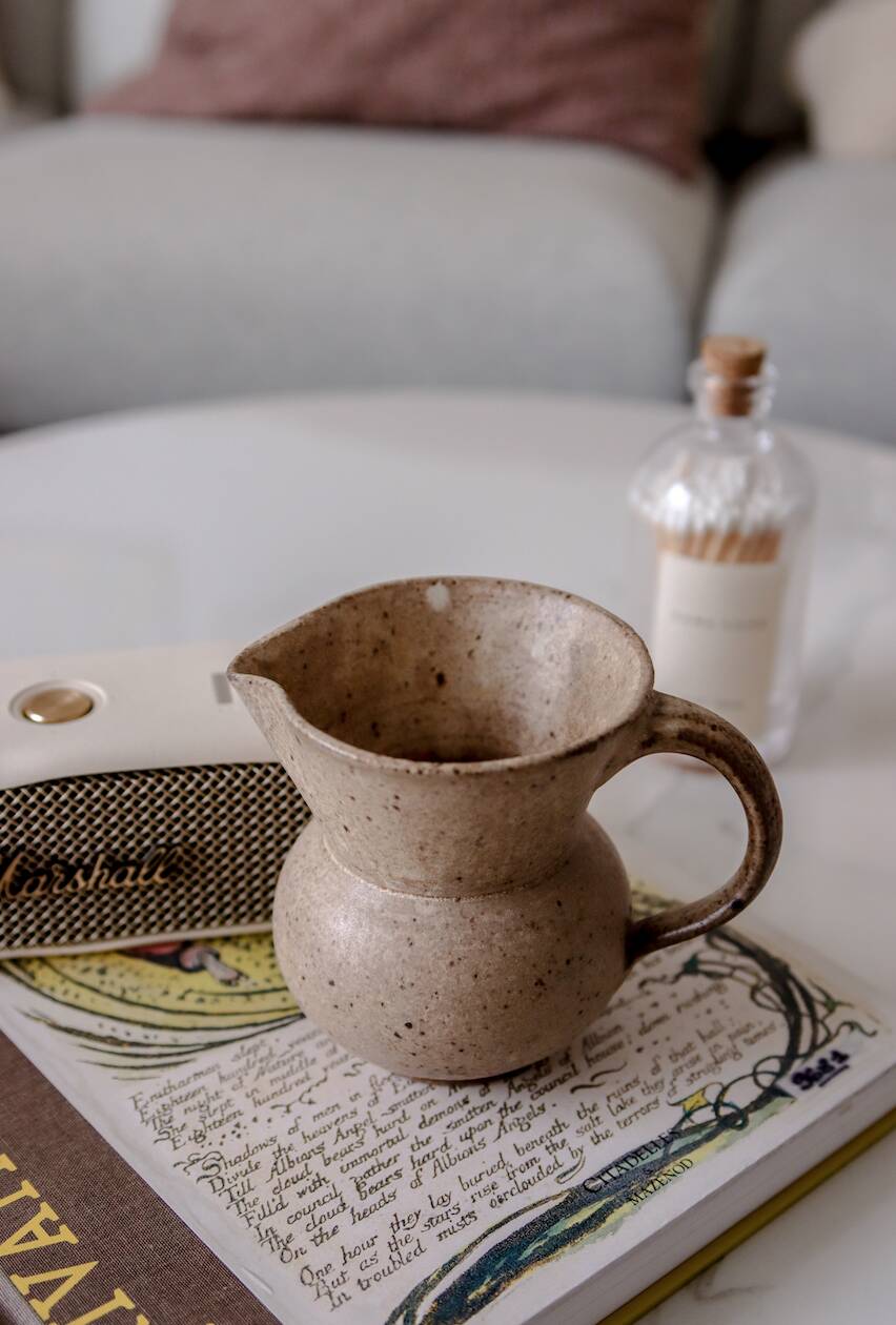 Small pitcher in old speckled stoneware