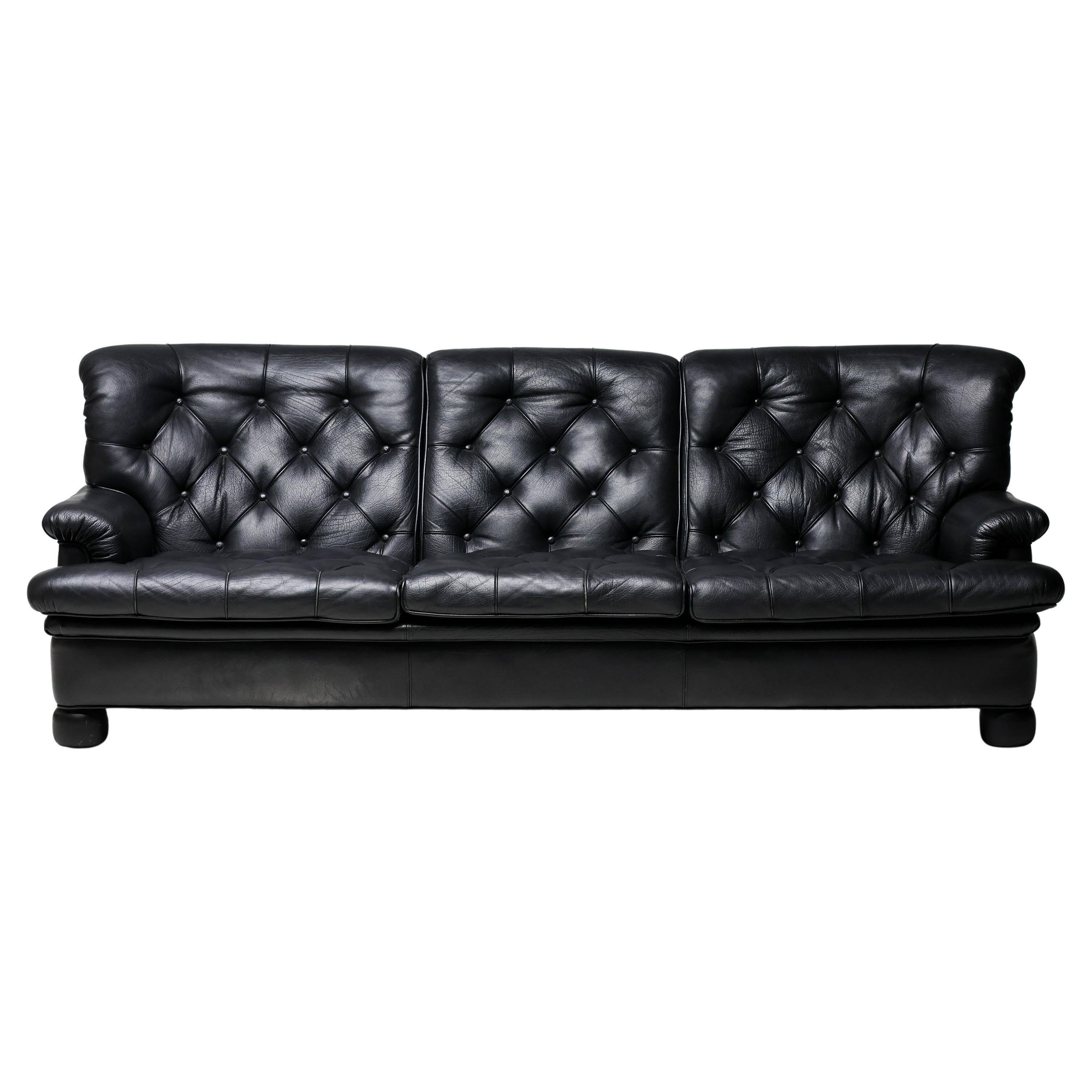 Three-seater sofa "Jupiter" in black leather by Arne Norell, Sweden, 1960.