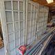 Two pairs of solid oak doors with small panes.