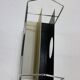 All metal magazine rack with sliding divider