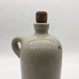 Old hot water bottle in glazed stoneware, gray color.