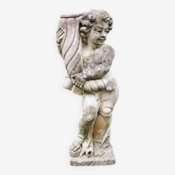 Old garden statue, reconstituted stone putto