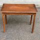 Vintage rectangular side table in solid oak from the 1920s.