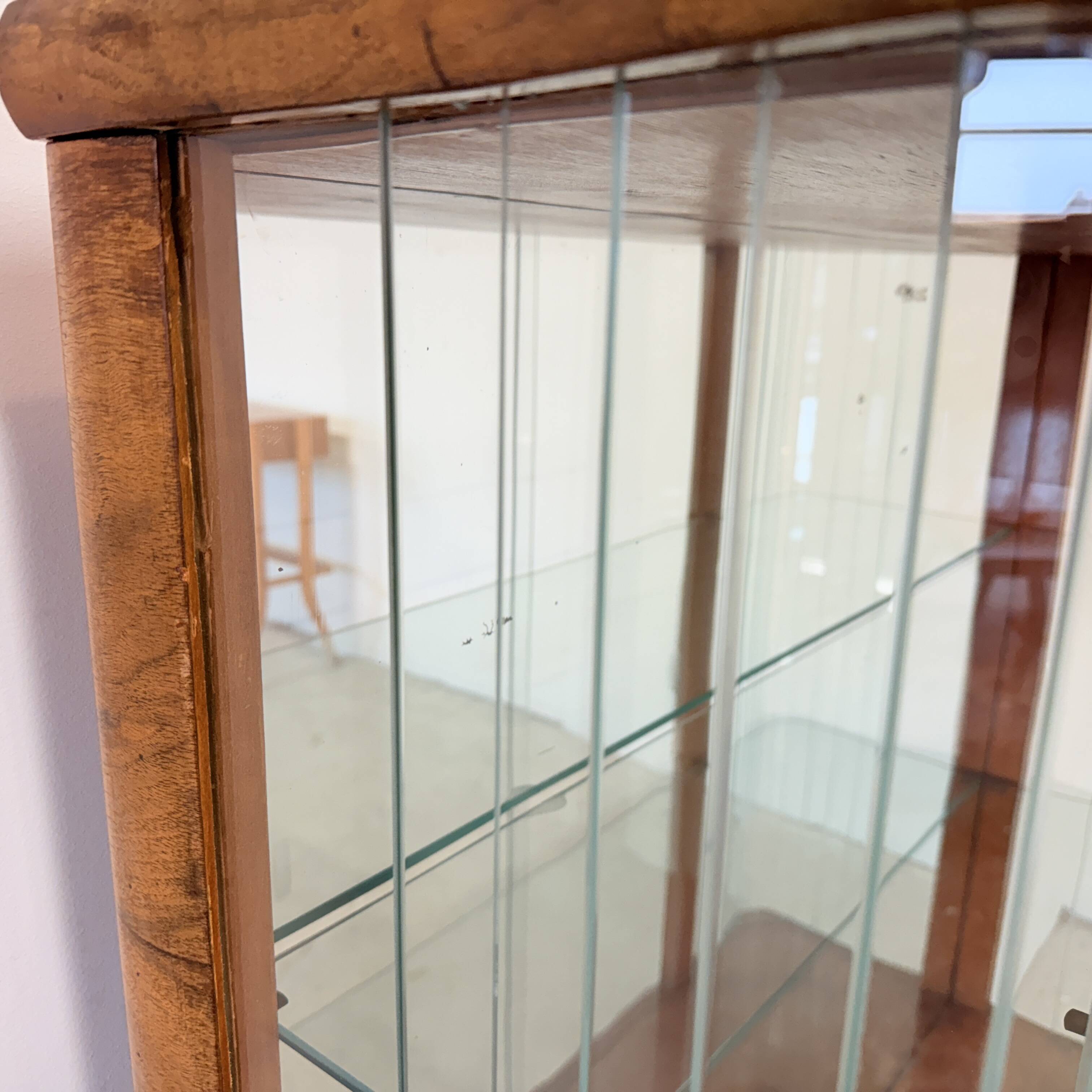 Elegant, curved display cabinet in Art Deco style