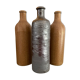 Lot de trois bouteilles en grès