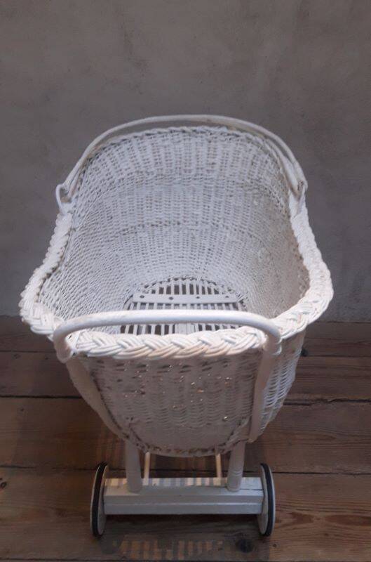 Wicker and painted wood baby cradle