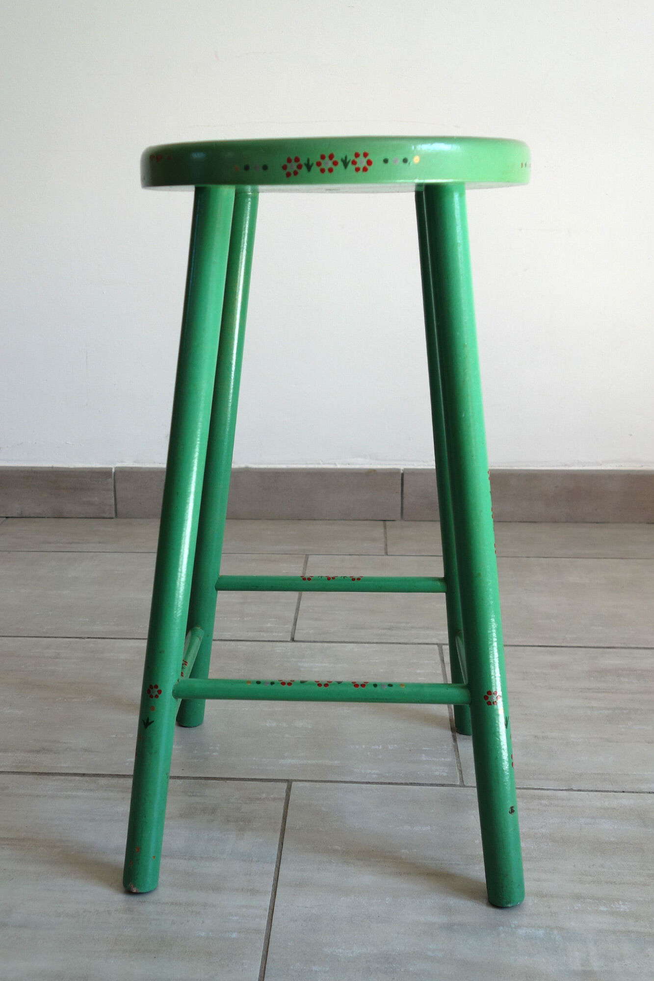 Old painted and decorated wooden stool