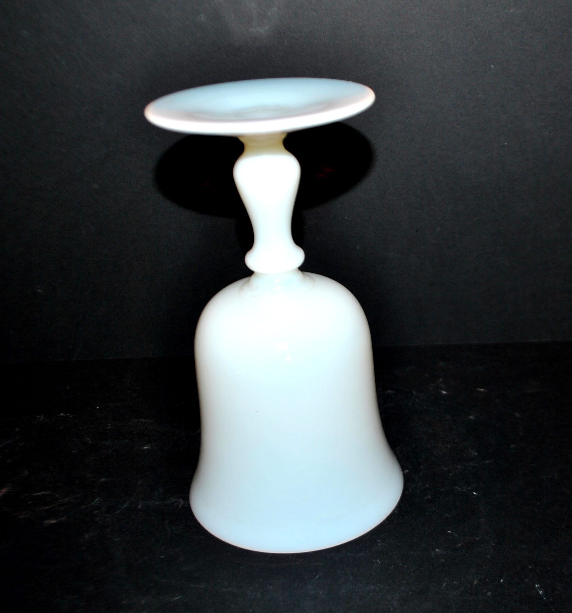 Ancient opaline white glass goblet with a soap bubble effect.