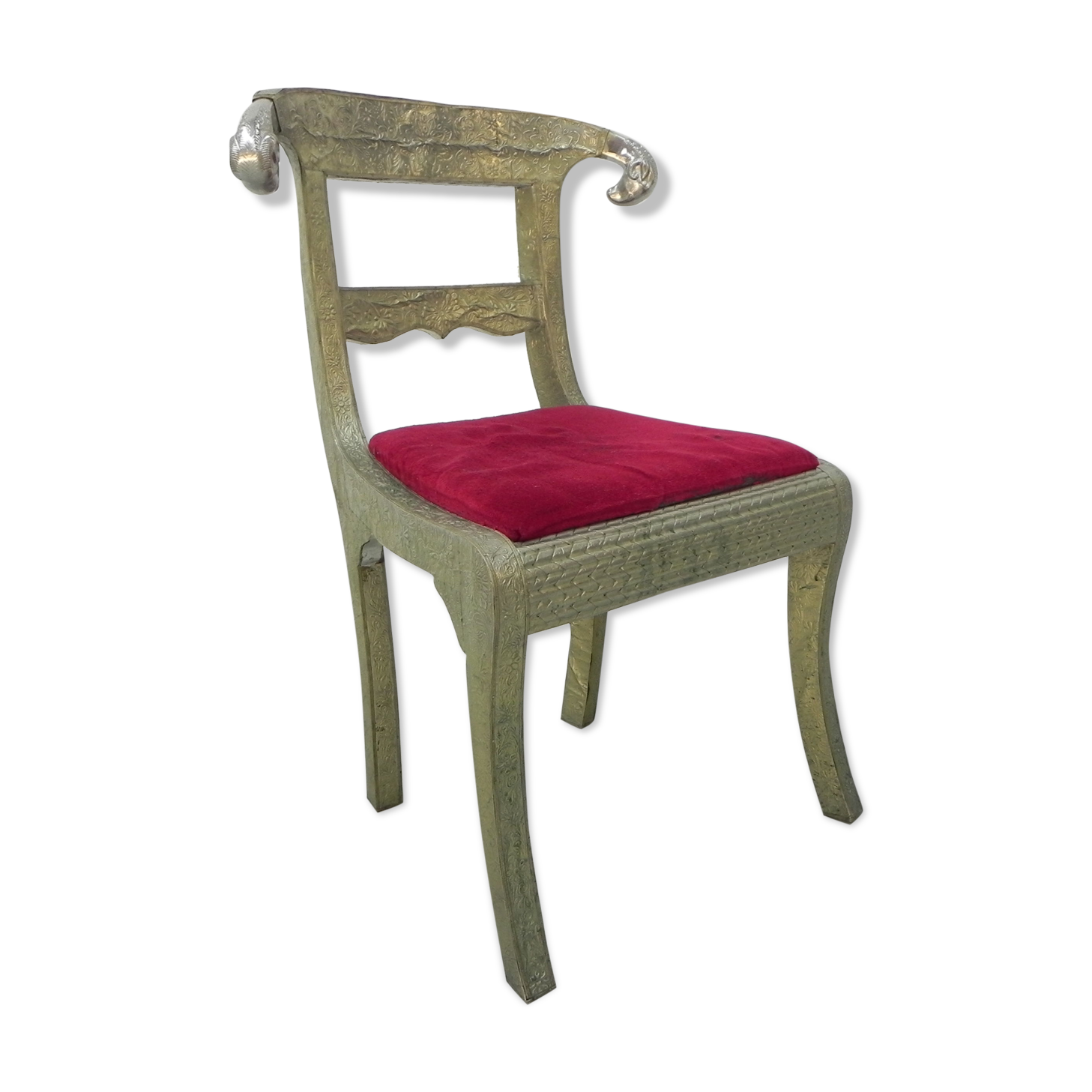 Dining chair upholstered with stamped tin