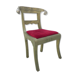 Dining chair upholstered with stamped tin