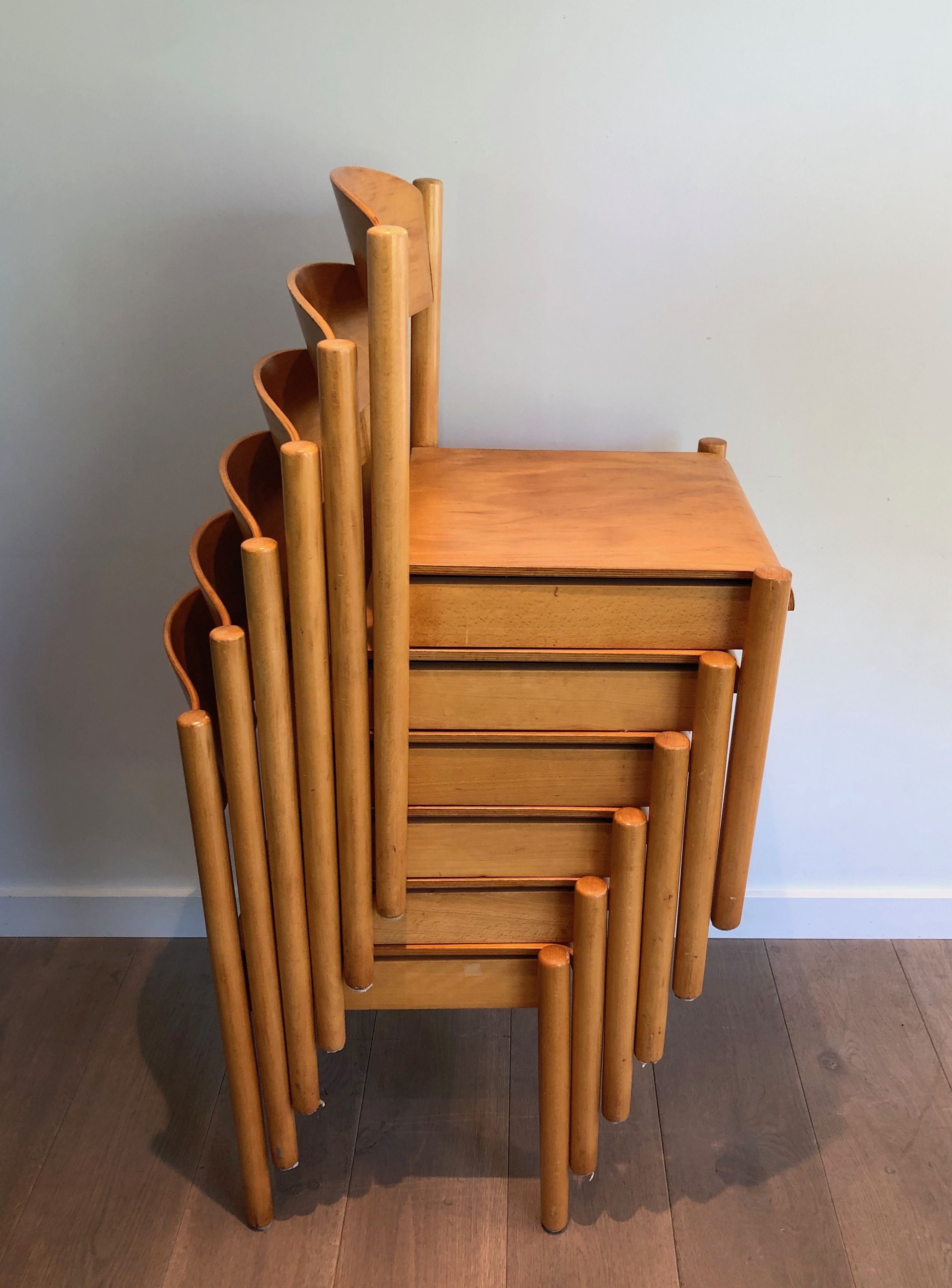Set of 6 stackable chairs in fir wood.