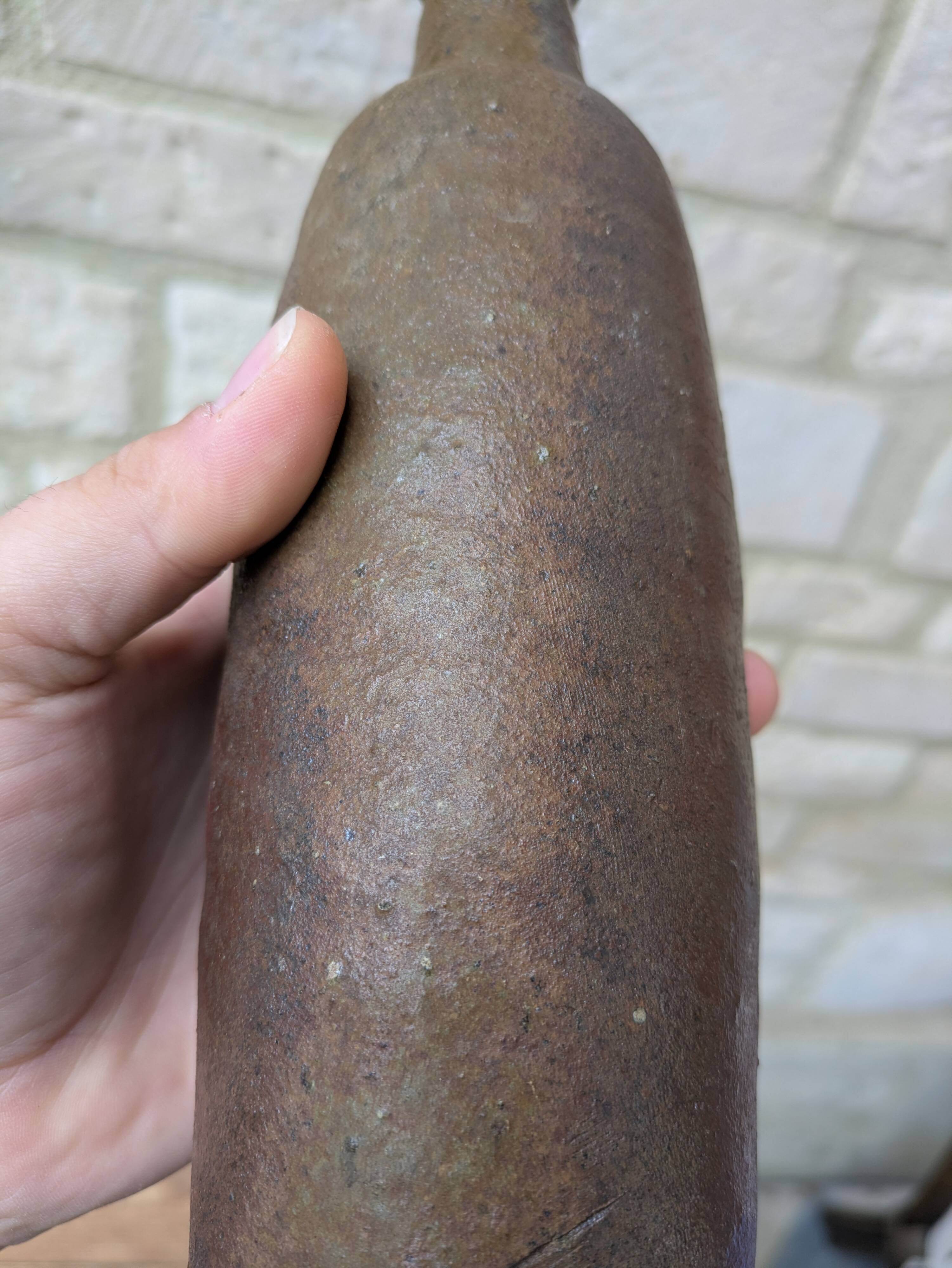 Old handmade terracotta bottle