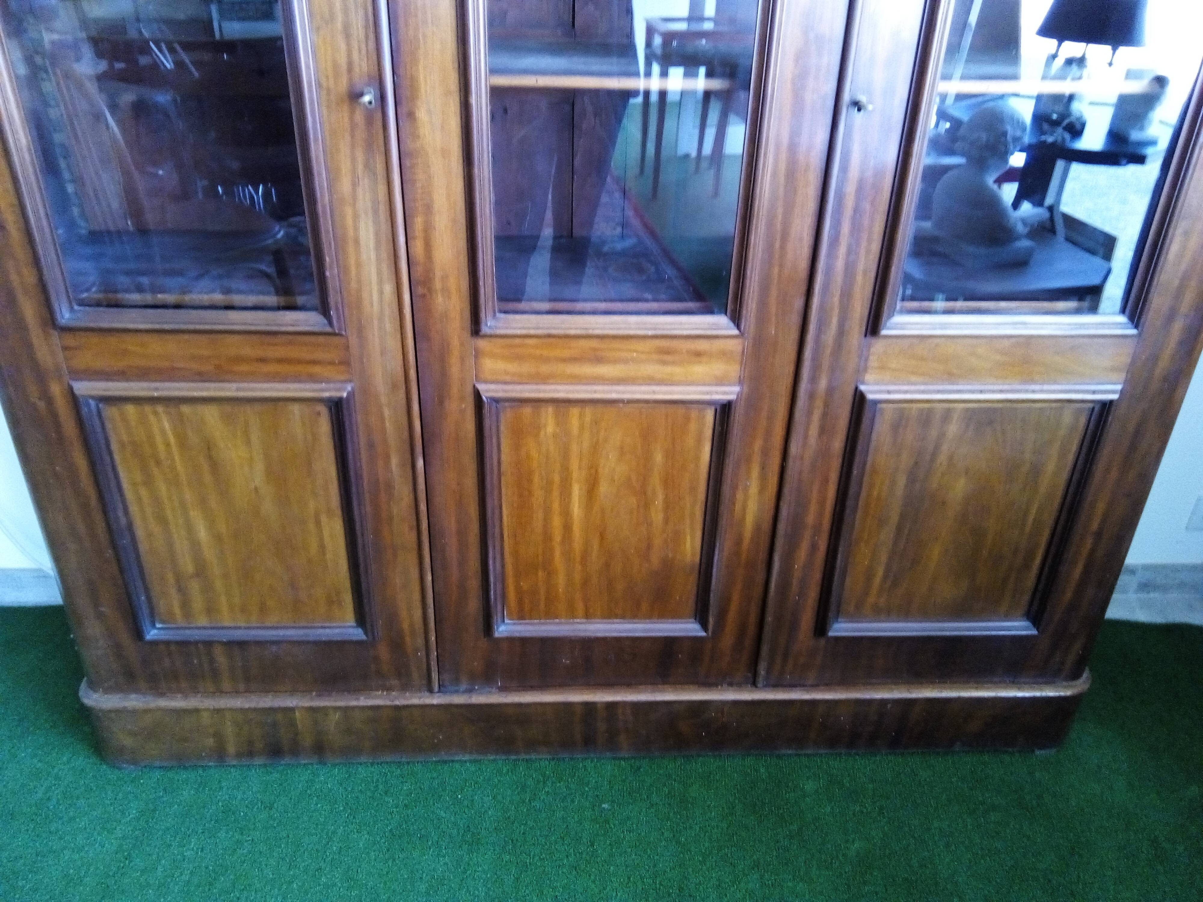 Mahogany bookcase glazed glass warhead windows