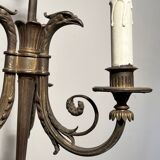 Empire-style bronze chandelier with 3 arms of light topped with eagle heads. French work. Circa 1900.