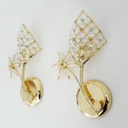 Pair of vintage floral wall sconces in gold metal and tassel
