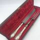 Antique silver-plated metal serving cutlery.