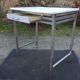 Vintage table with square chrome tubular metal base and marble top.
