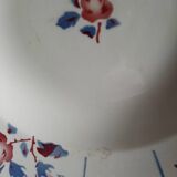 Mismatched old soup plates accompanied by a soup tureen