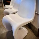 4 white Panton style armchairs