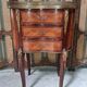 Lady's demi-lune commode in Louis XV style with marquetry and gilded bronze.