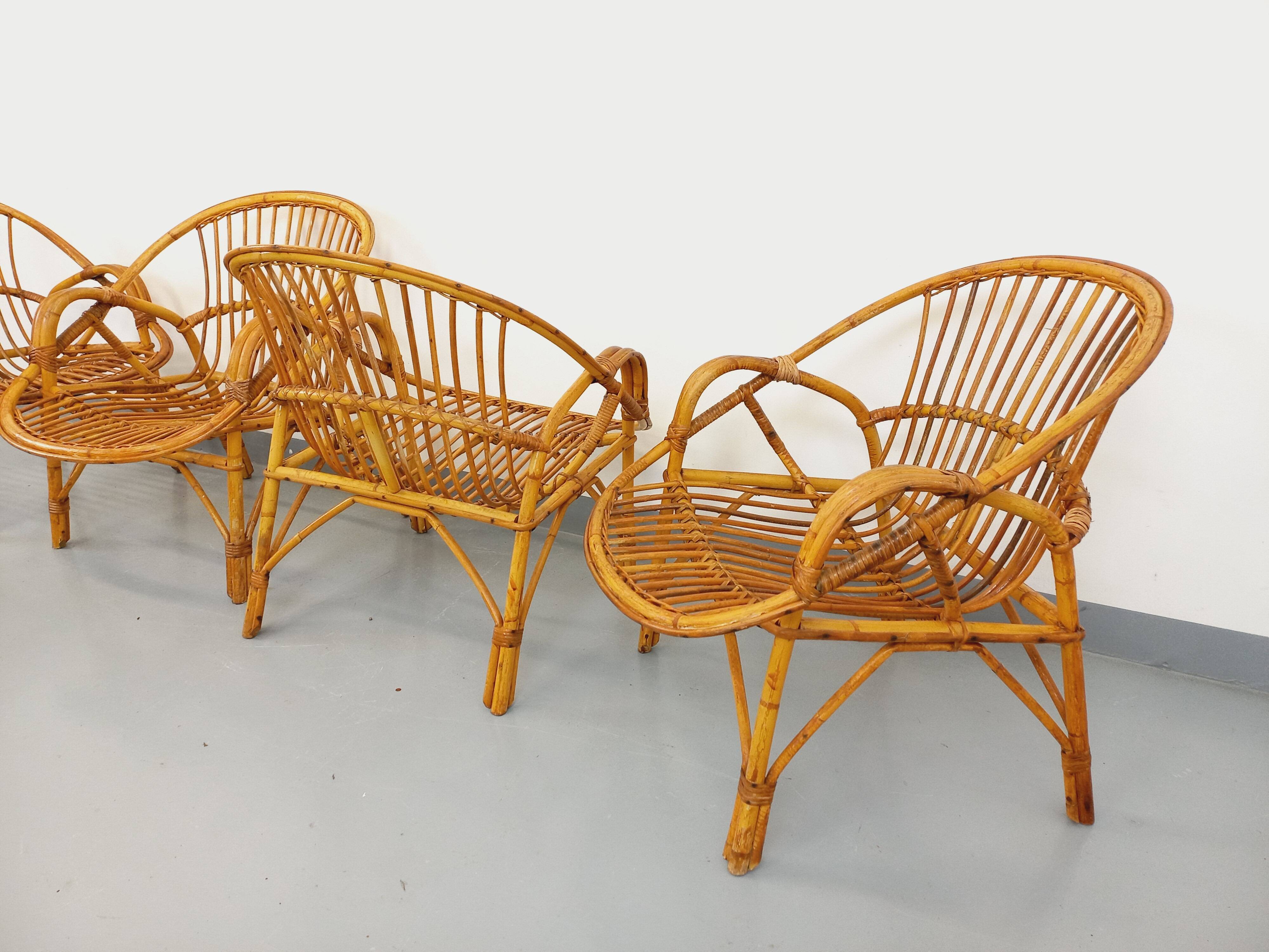 Set of 4 vintage rattan armchairs from the 60s