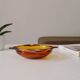Vintage amber Duralex ashtray from the 1970s.