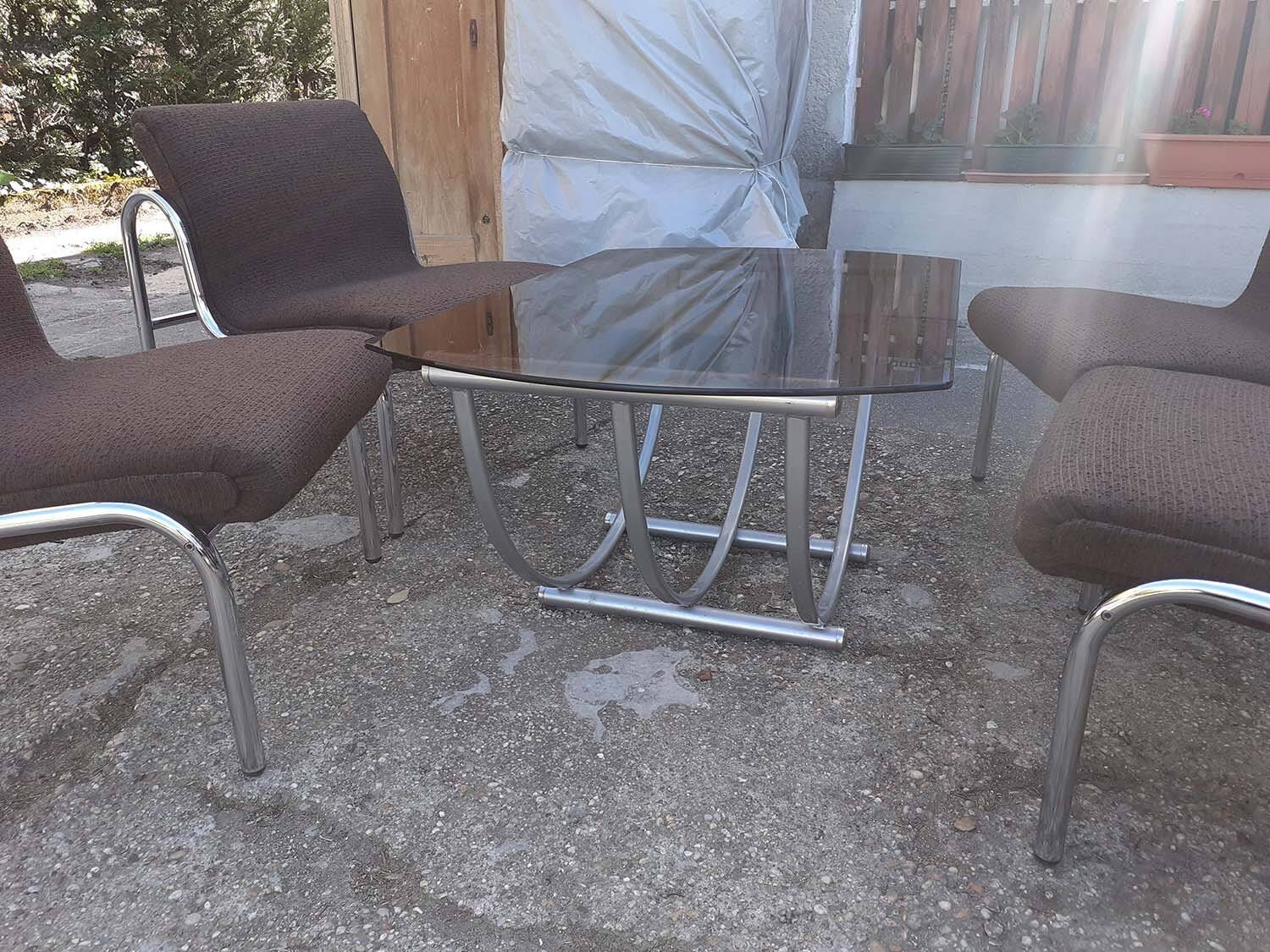 Table and 4 chairs in chrome metal with brown fabric and wood, Hungarian design from the 1960s.
