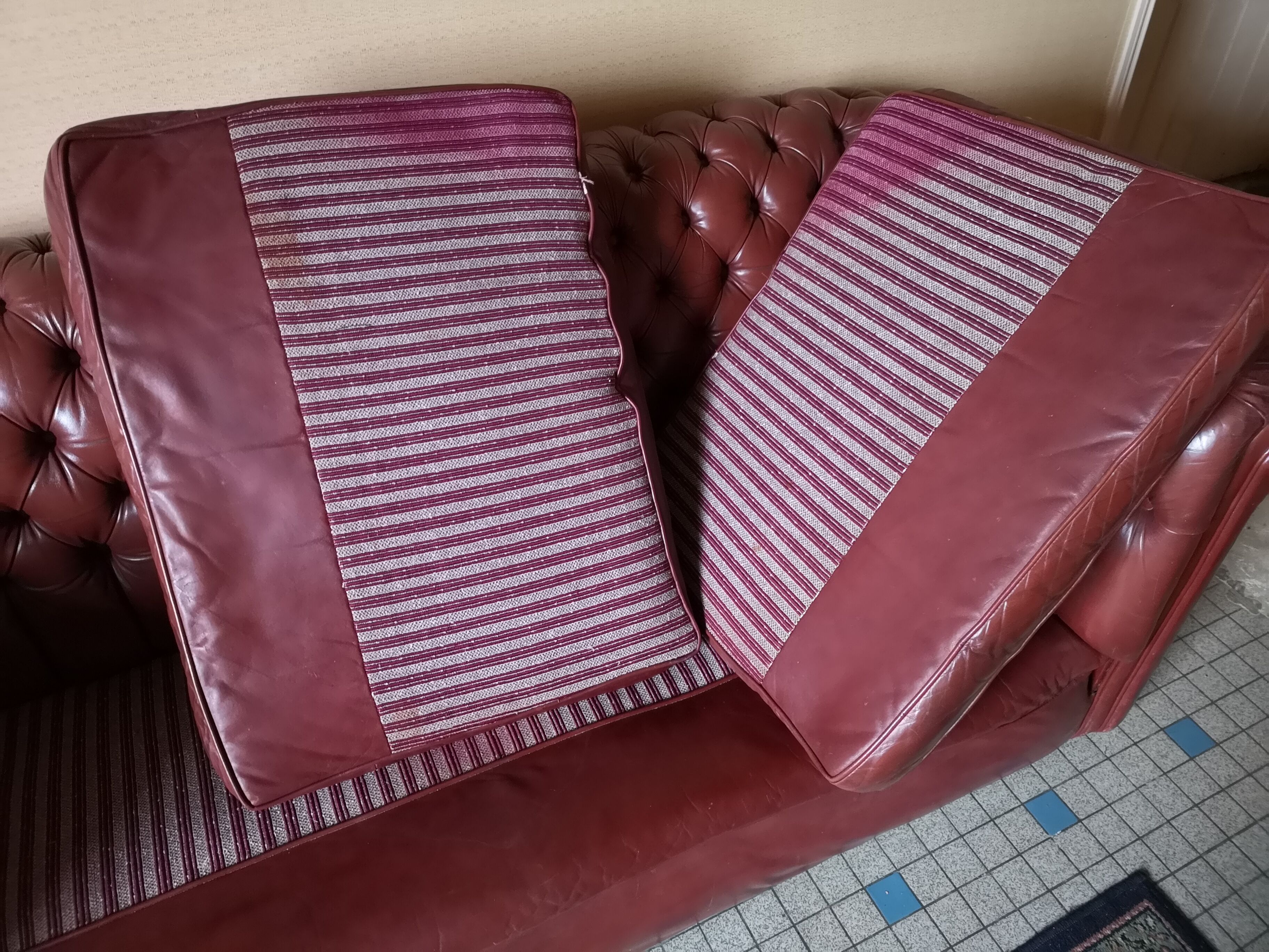 Old red leather Chesterfield sofa