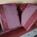 Old red leather Chesterfield sofa