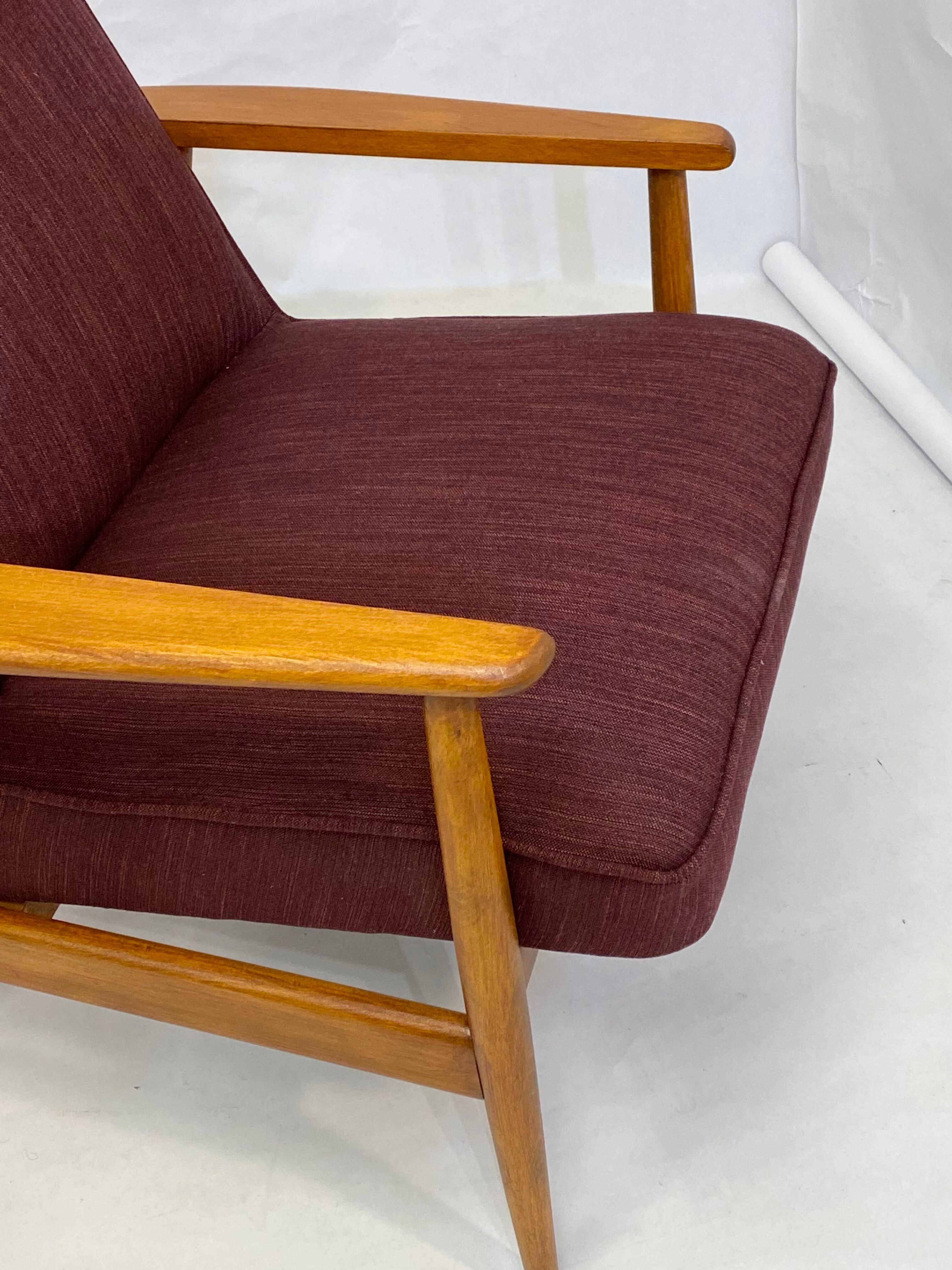 Chair created by Mr. Zieliski year 60 burgundy fabric.