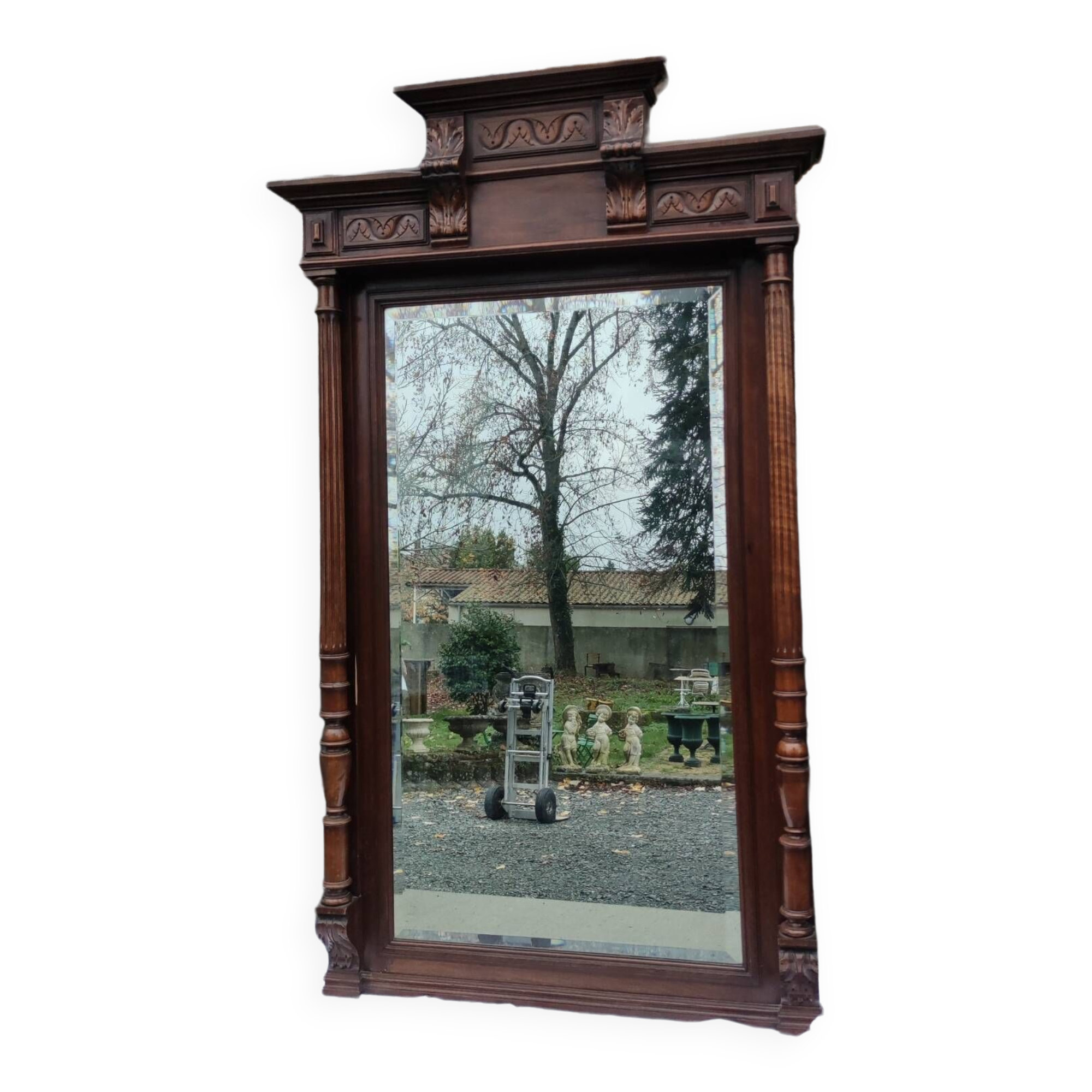 Old large carved wooden mirror